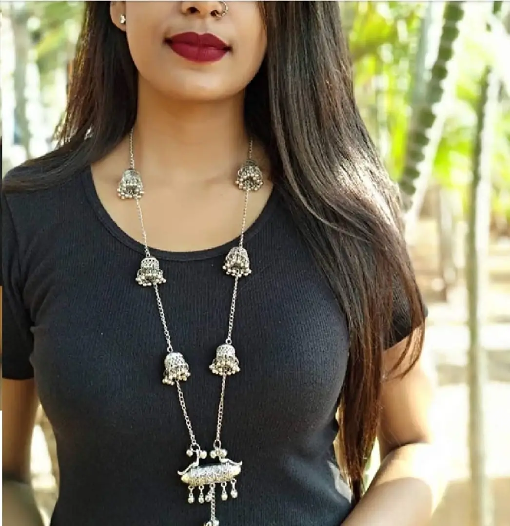 silver jhumkas and necklace