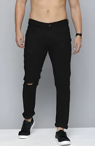 Damaged black fashion jeans